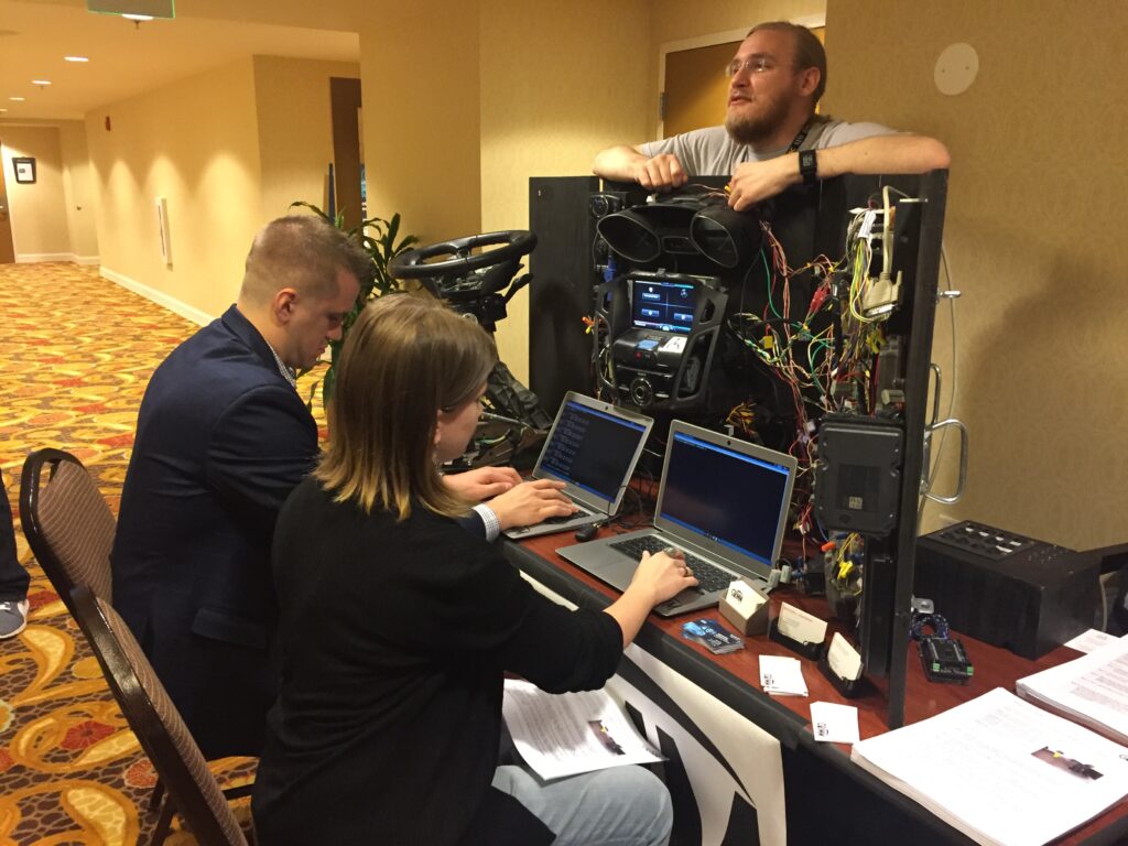 2 people testing at Grimm's booth